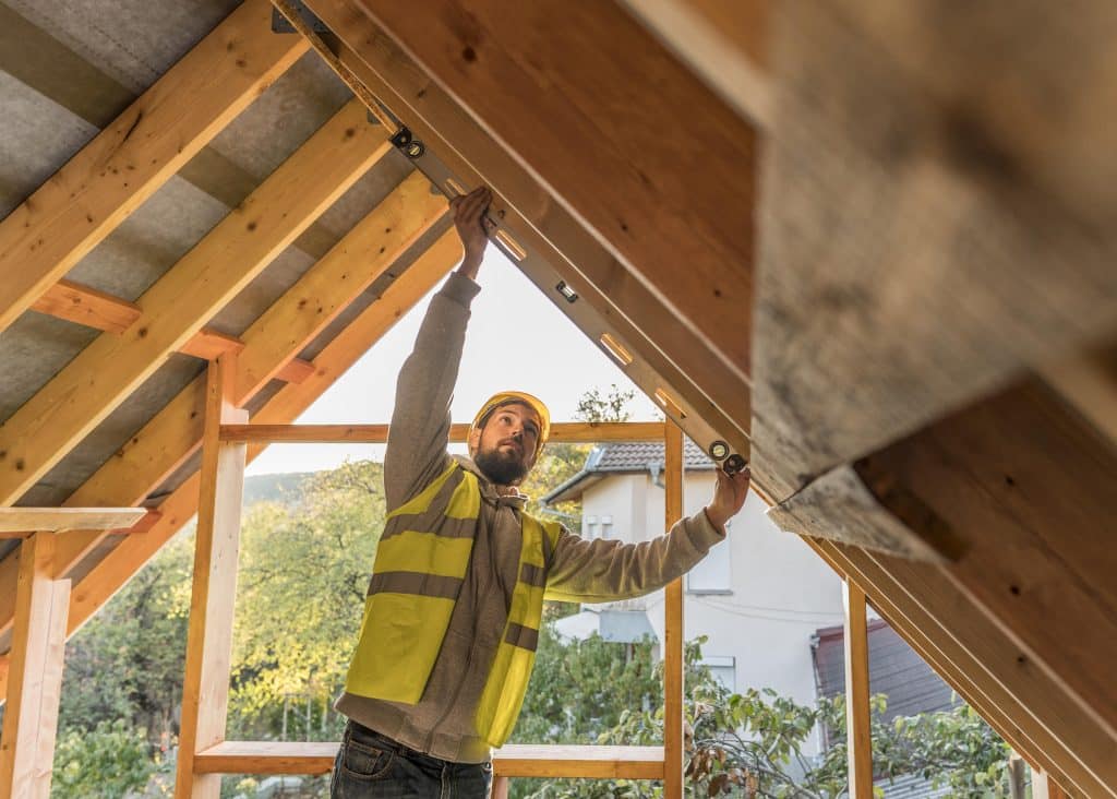 construction worker measuring beams